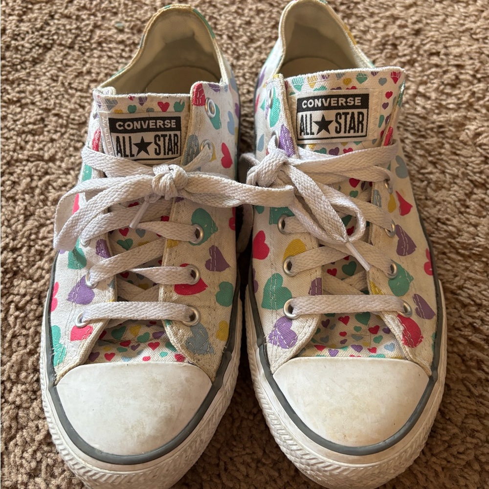 Converse heart pattern sneakers